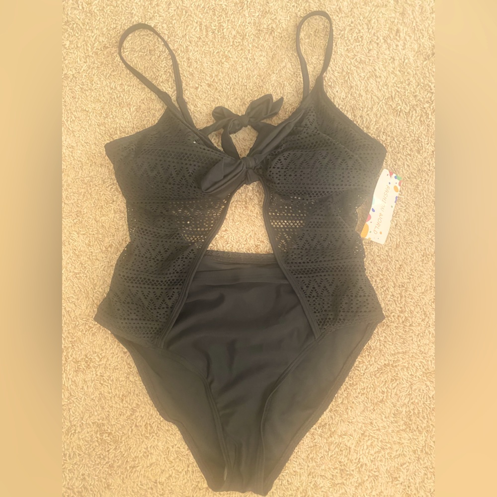 New with tags, one piece cutout swimsuit, size medium